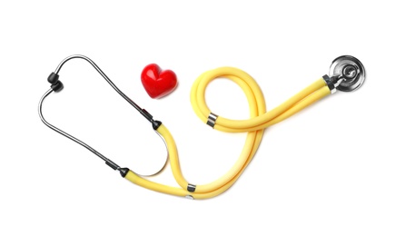 Stethoscope for checking pulse and red heart on white background, top view