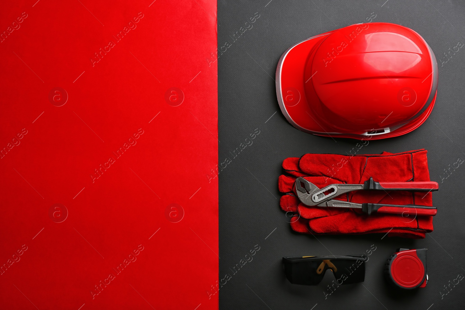 Photo of Flat lay composition with safety equipment and space for text on color background