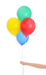 Woman holding bunch of colorful balloons on white background