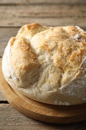 Freshly baked sourdough bread on wooden table