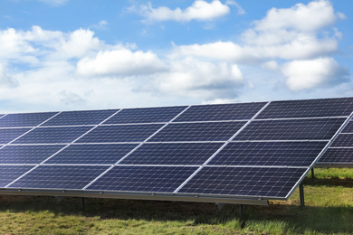 Photo of Solar panels installed outdoors. Alternative energy source