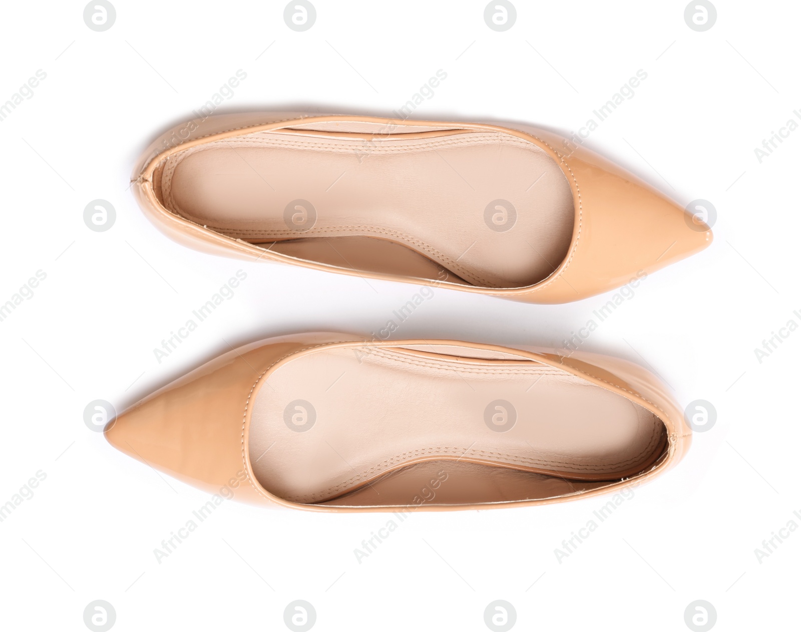 Photo of Stylish female flat shoes on white background, top view