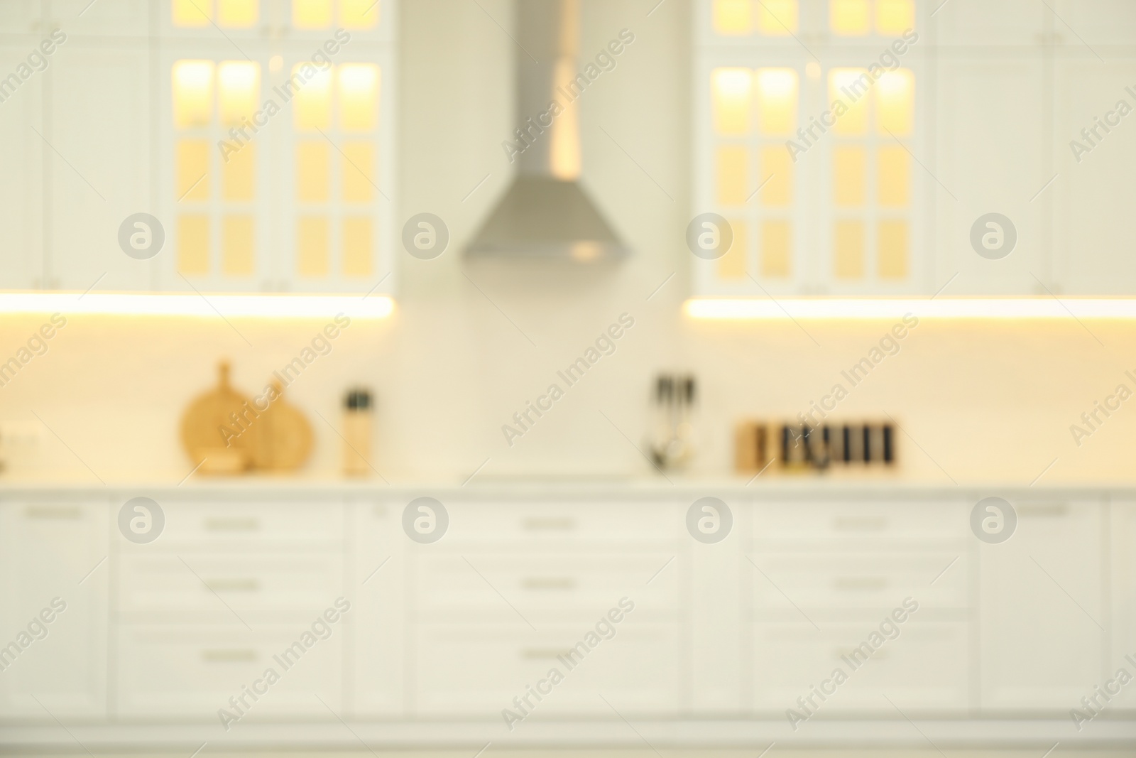 Photo of Blurred view of modern kitchen interior with stylish furniture