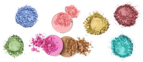 Set of different crushed eye shadows on white background, top view. Bright palette