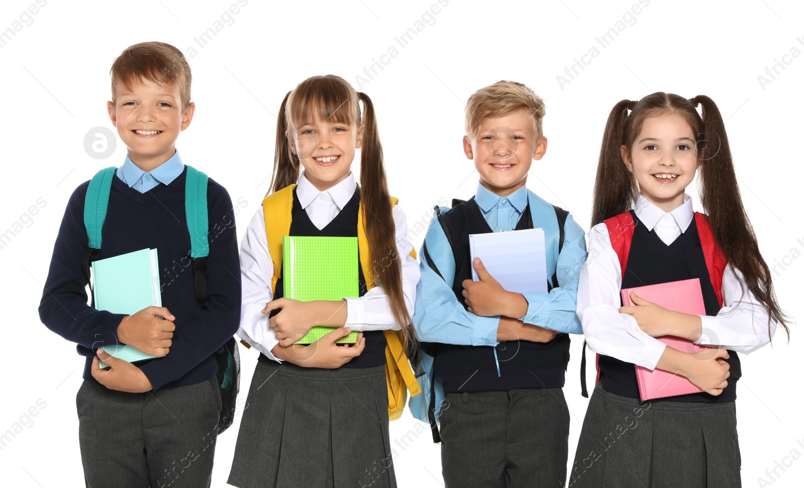 Photo of Little children in stylish school uniform on white background