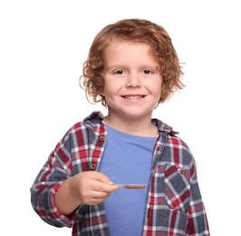 Cute boy with cough syrup in measuring spoon on white background. Effective medicine