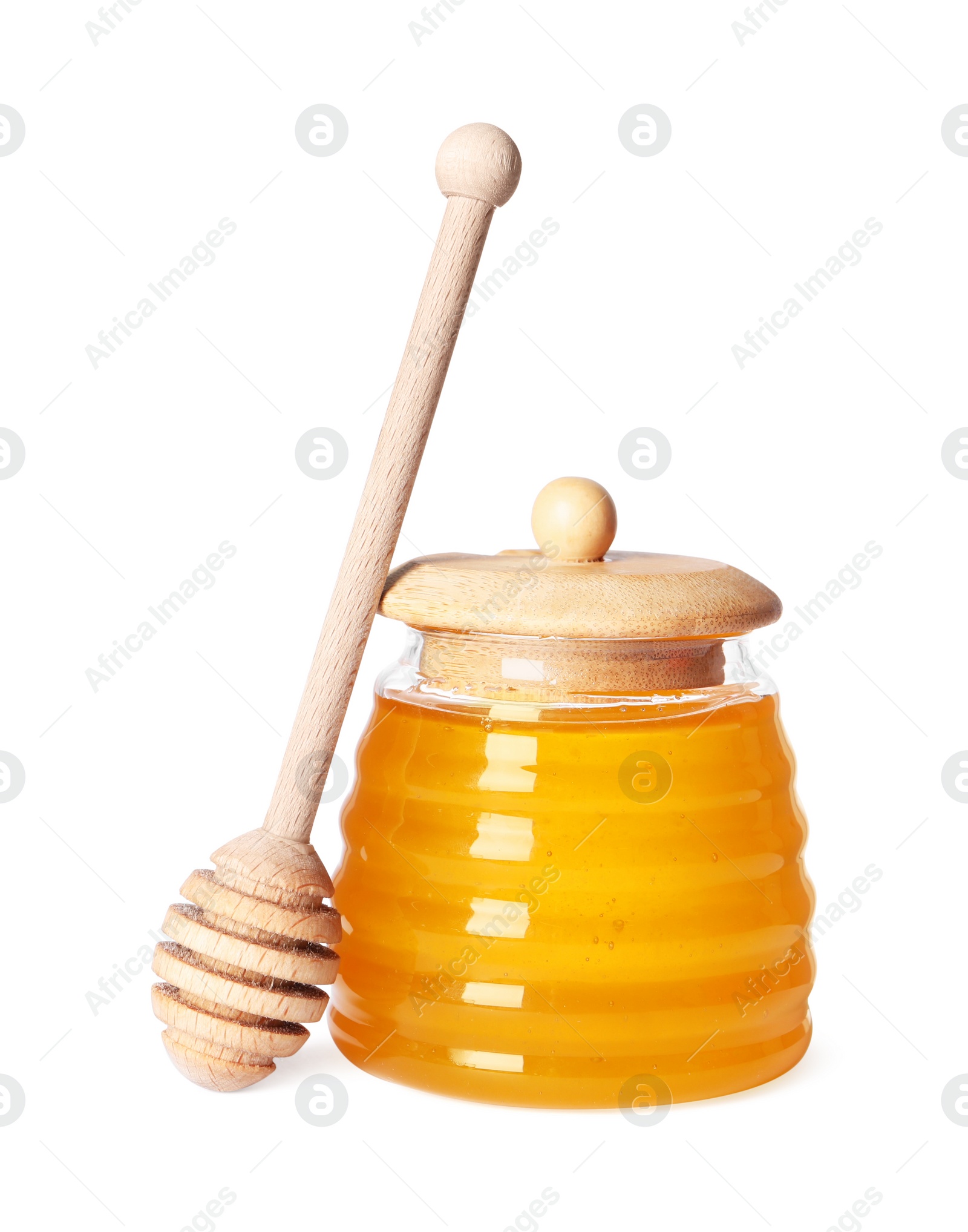 Photo of Tasty natural honey in glass jar and dipper isolated on white