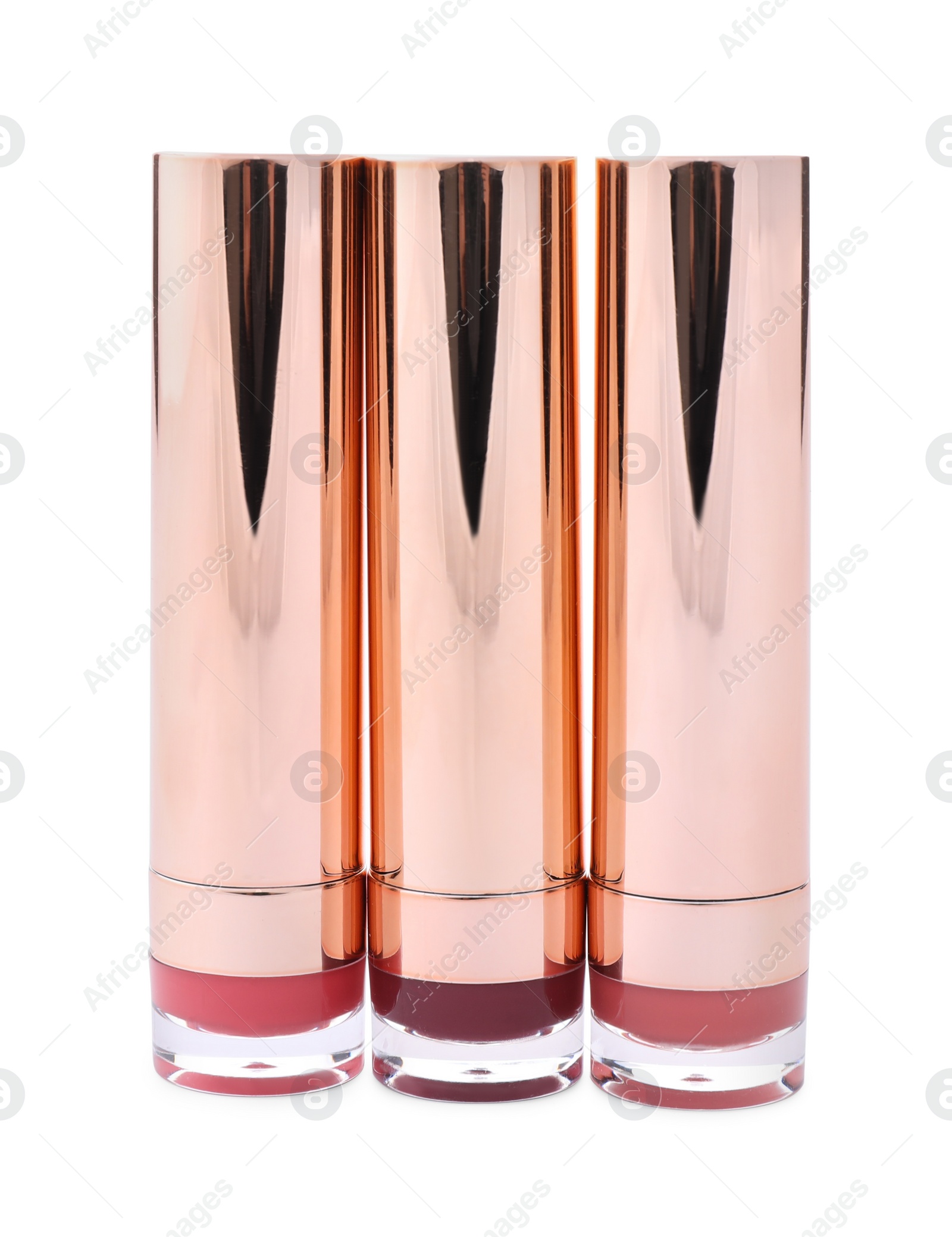 Photo of Different color lipsticks isolated on white. Makeup products