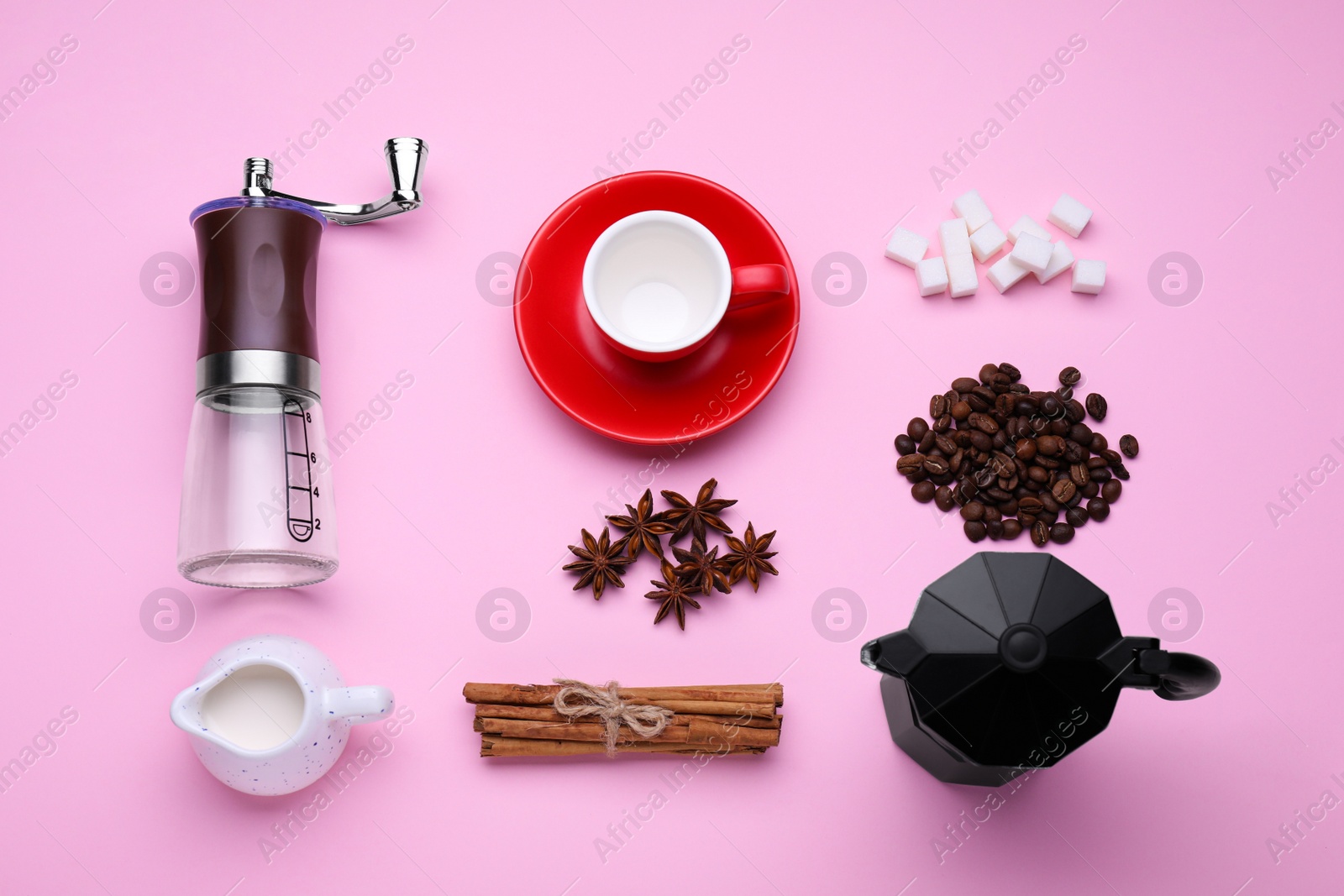 Photo of Flat lay composition with manual coffee grinder and spices on pink background