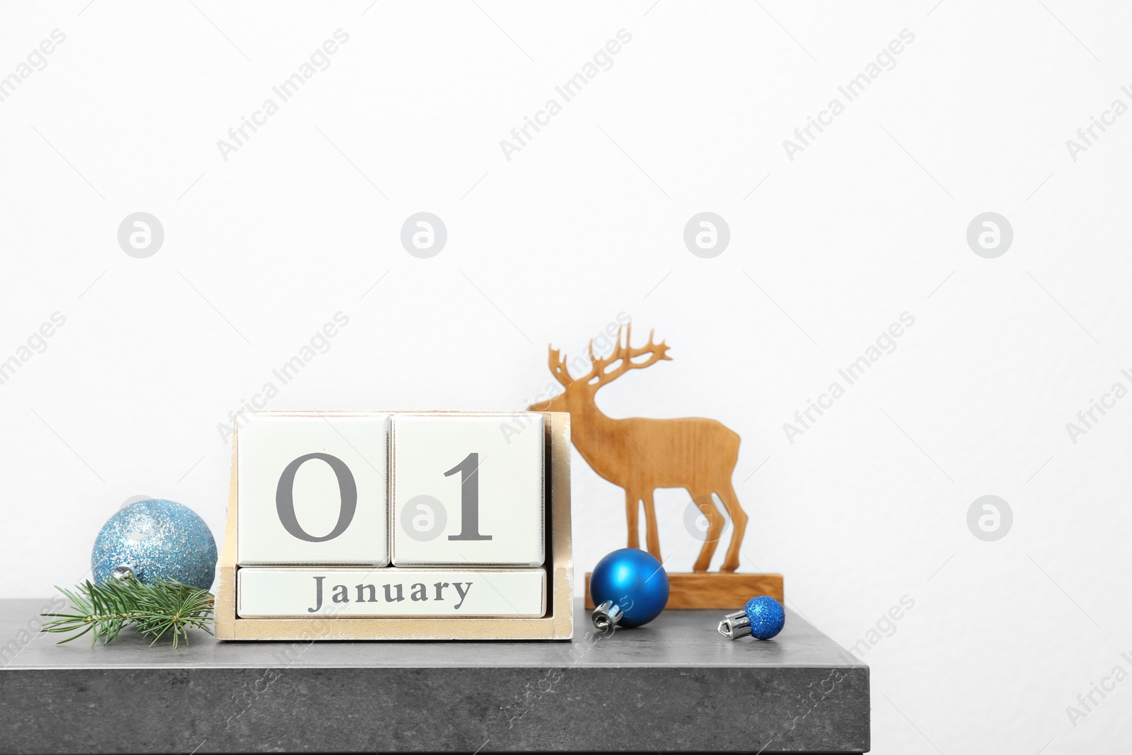 Photo of Wooden block calendar and festive decor on table. Christmas countdown