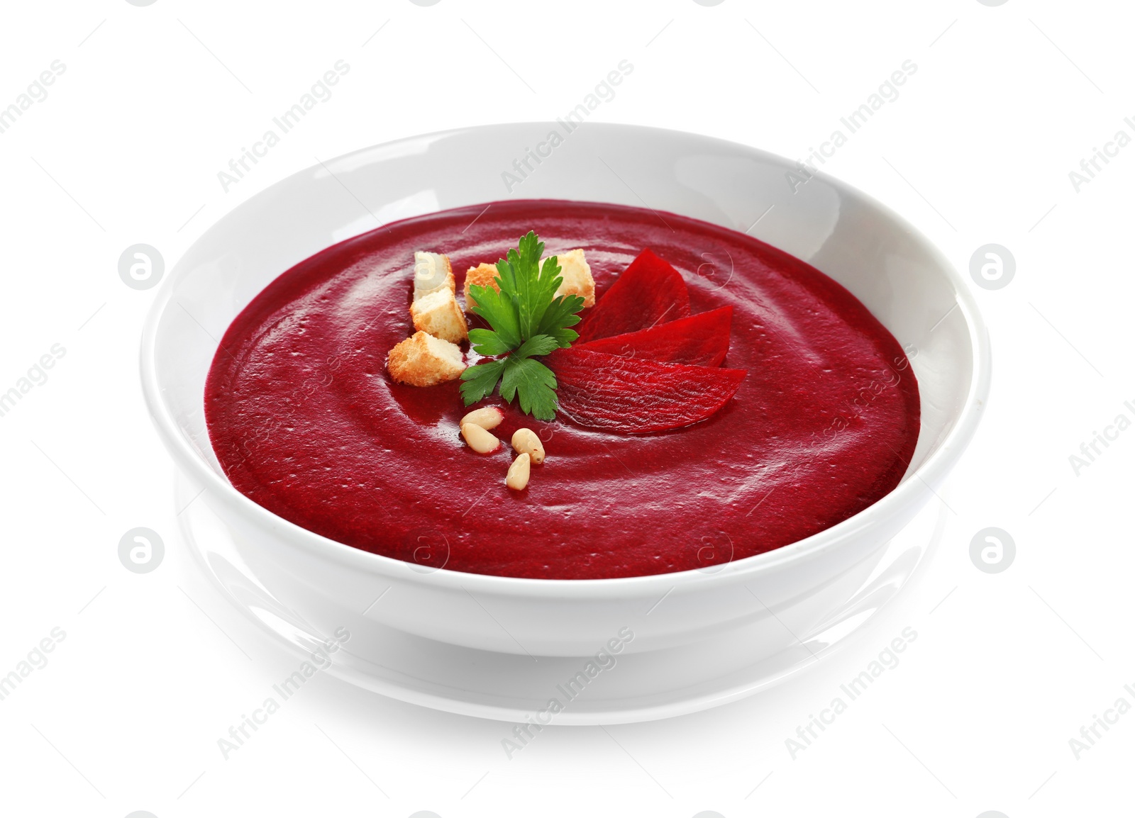 Photo of Dish with beet cream soup on white background. Healthy food