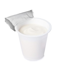 Photo of Plastic cup with delicious organic yogurt isolated on white