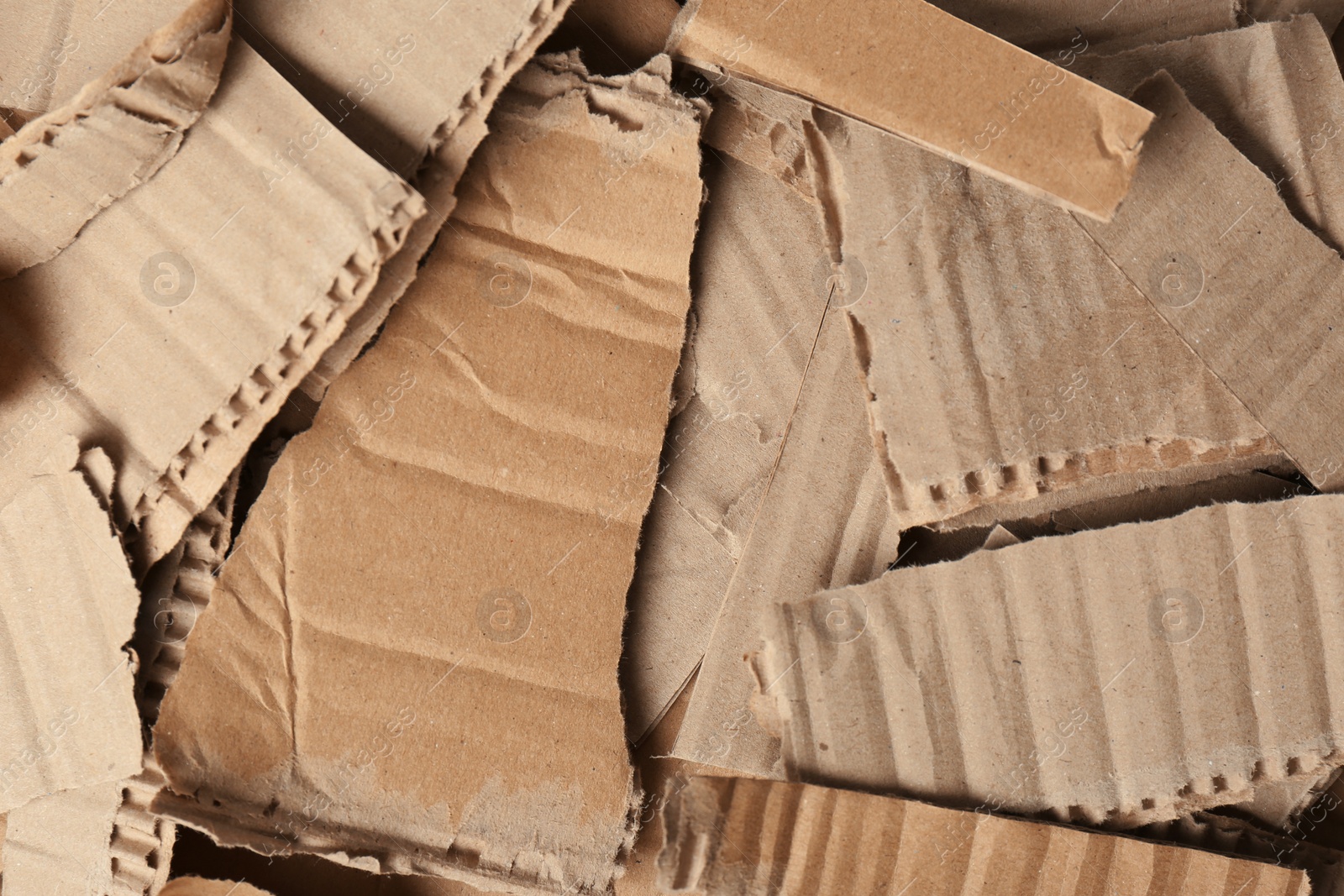 Photo of Pieces of brown cardboard as background, top view. Recyclable material