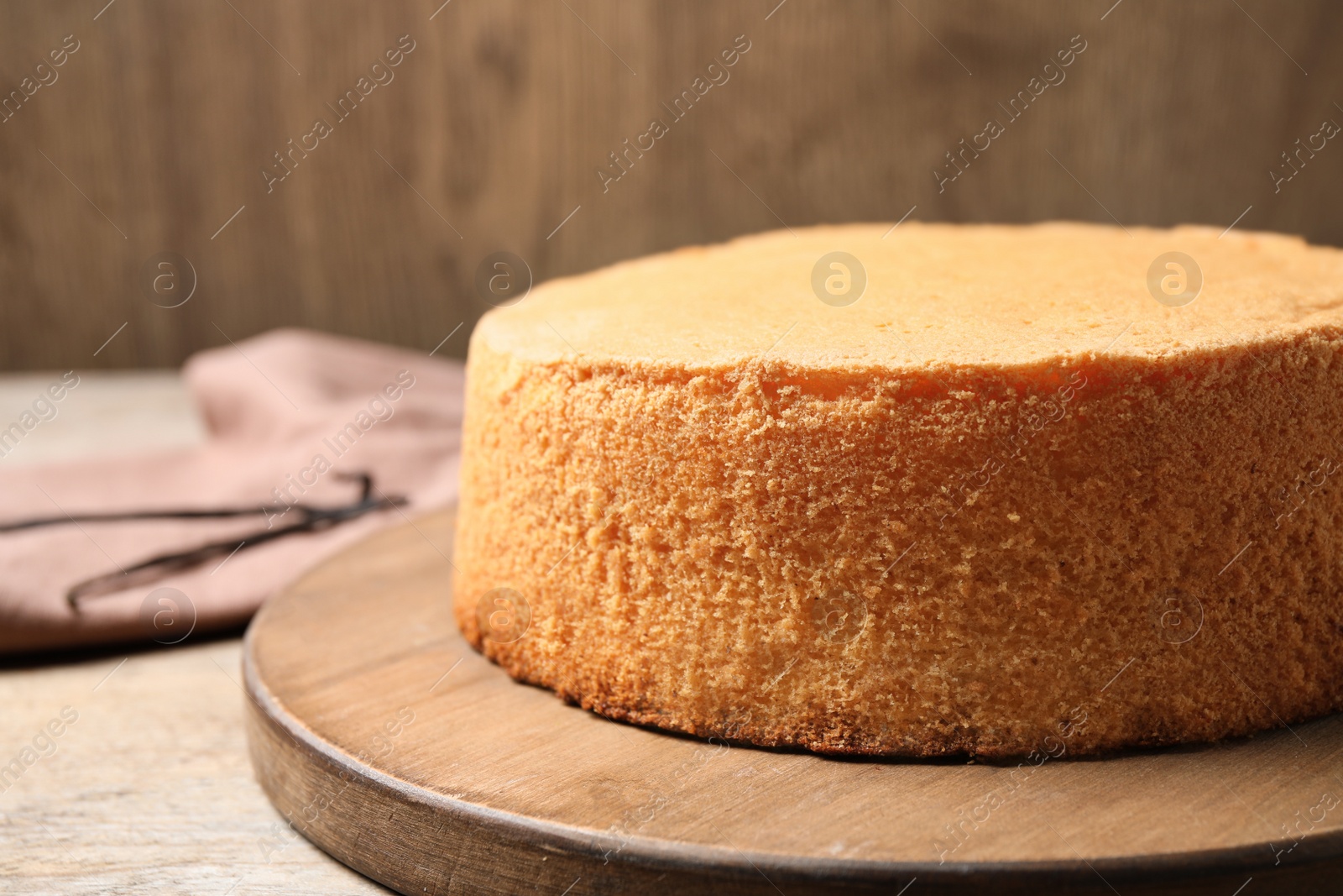 Photo of Delicious fresh homemade cake on wooden table, closeup