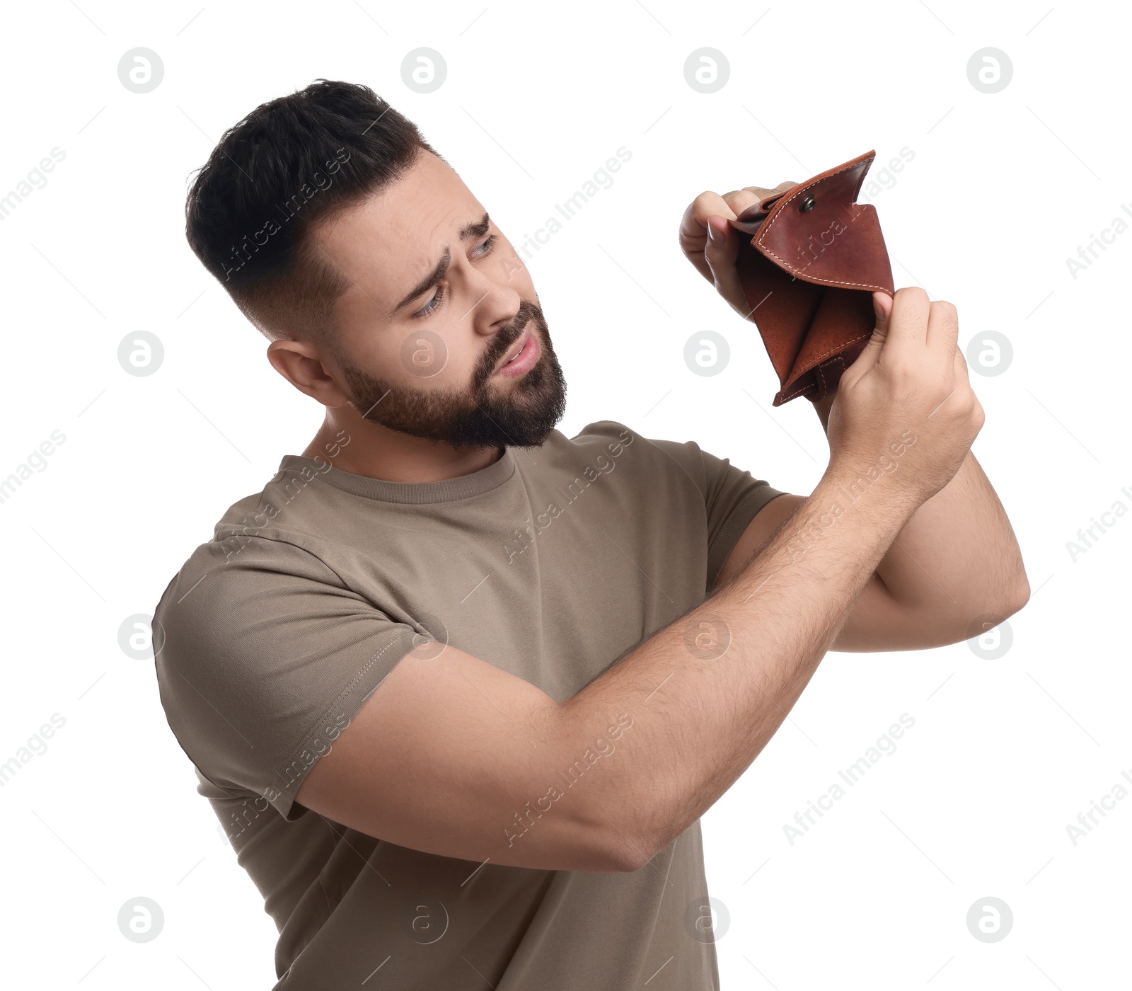 Photo of Upset man showing empty wallet on white background