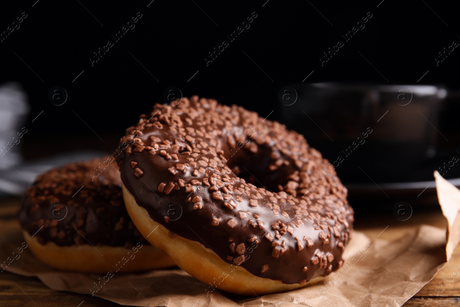 Photo of Delicious pastries and coffee on wooden table