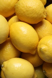 Photo of Many fresh lemons as background, top view