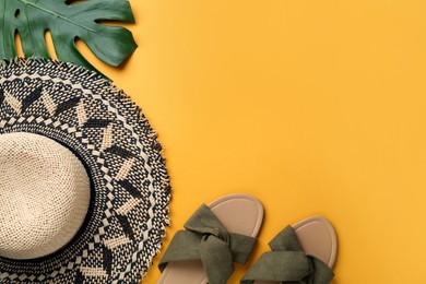 Photo of Flat lay composition with straw hat on yellow background. Space for text