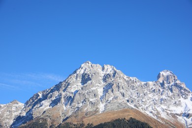 Photo of Picturesque view of beautiful high mountain under blue sky on sunny day