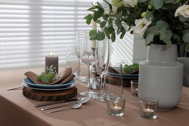 Festive table setting with beautiful tableware and decor indoors