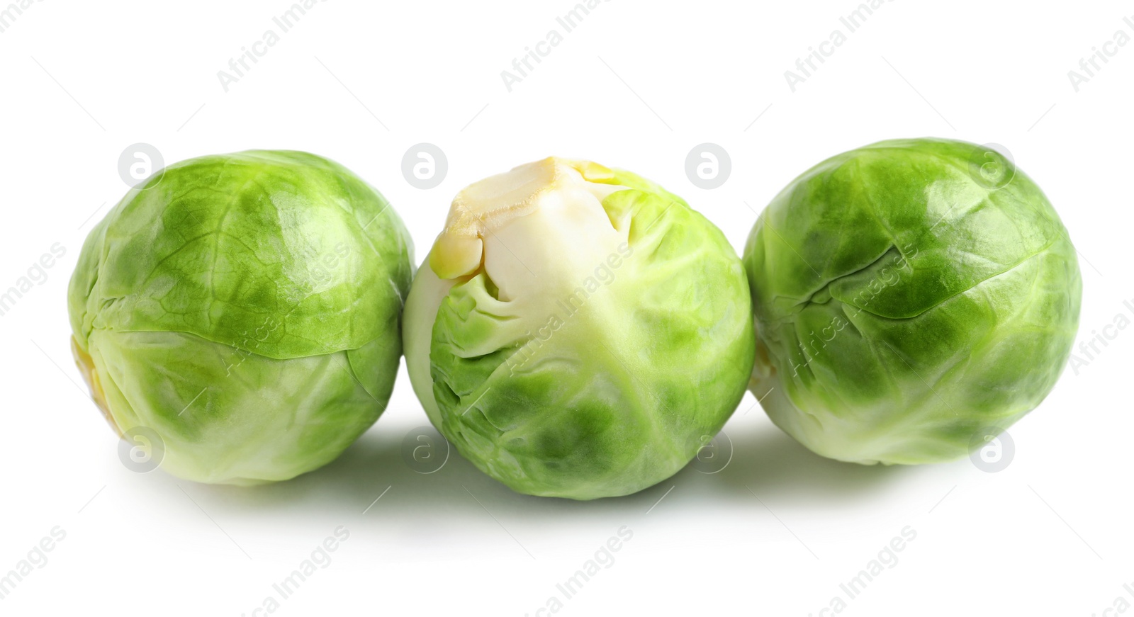 Photo of Fresh tasty Brussels sprouts on white background