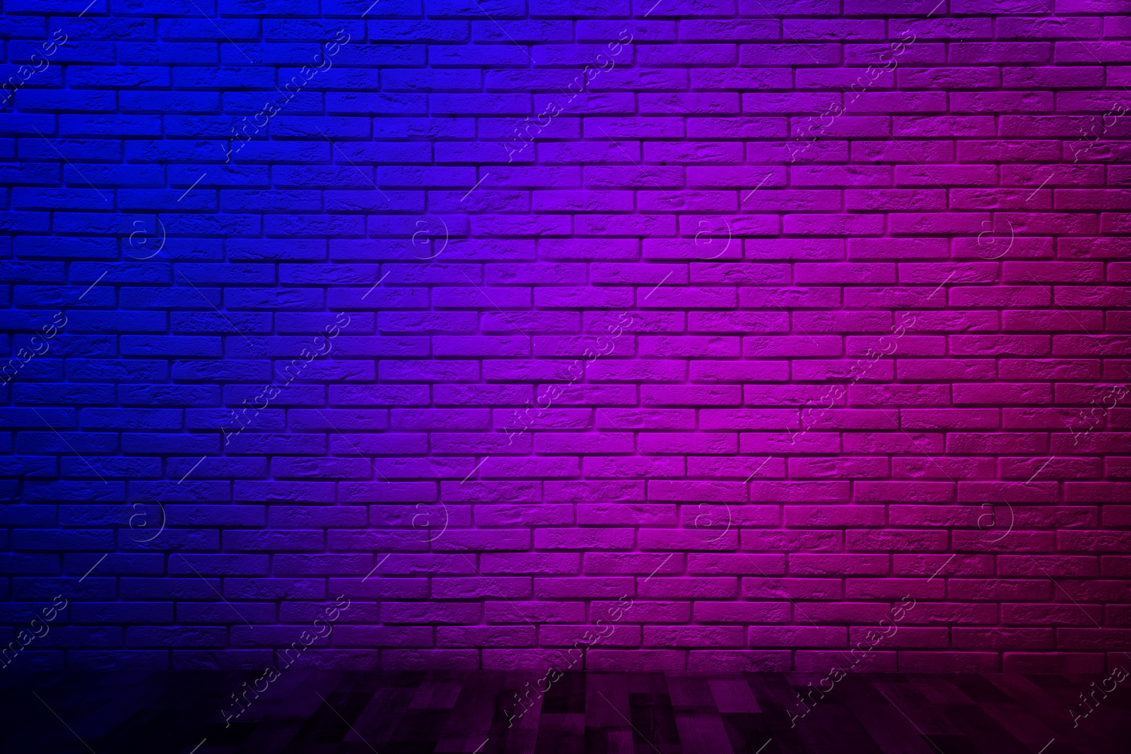 Image of Room with brick wall and wooden floor in neon lights