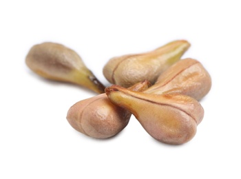 Photo of Seeds of grape berries on white background. Natural essential oil ingredient