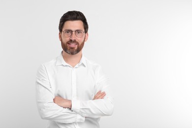 Photo of Portrait of handsome man in glasses on white background. Space for text