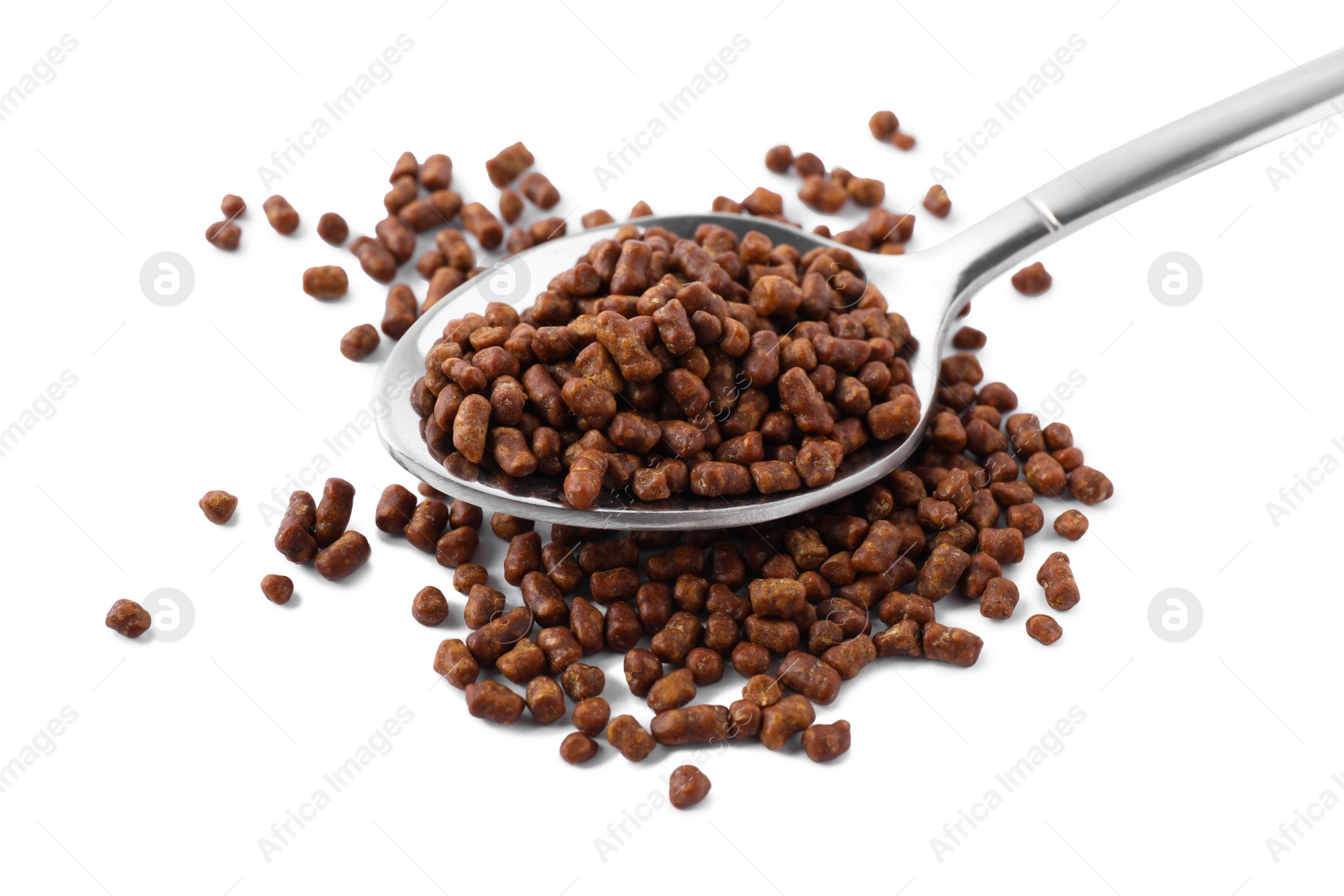 Photo of Spoon with buckwheat tea granules on white background
