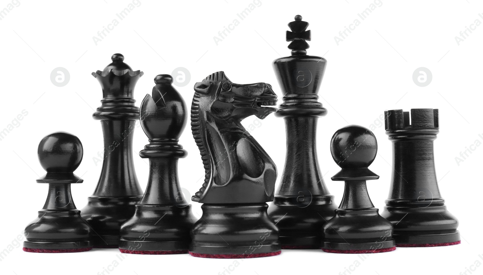 Photo of Set of black chess pieces on white background