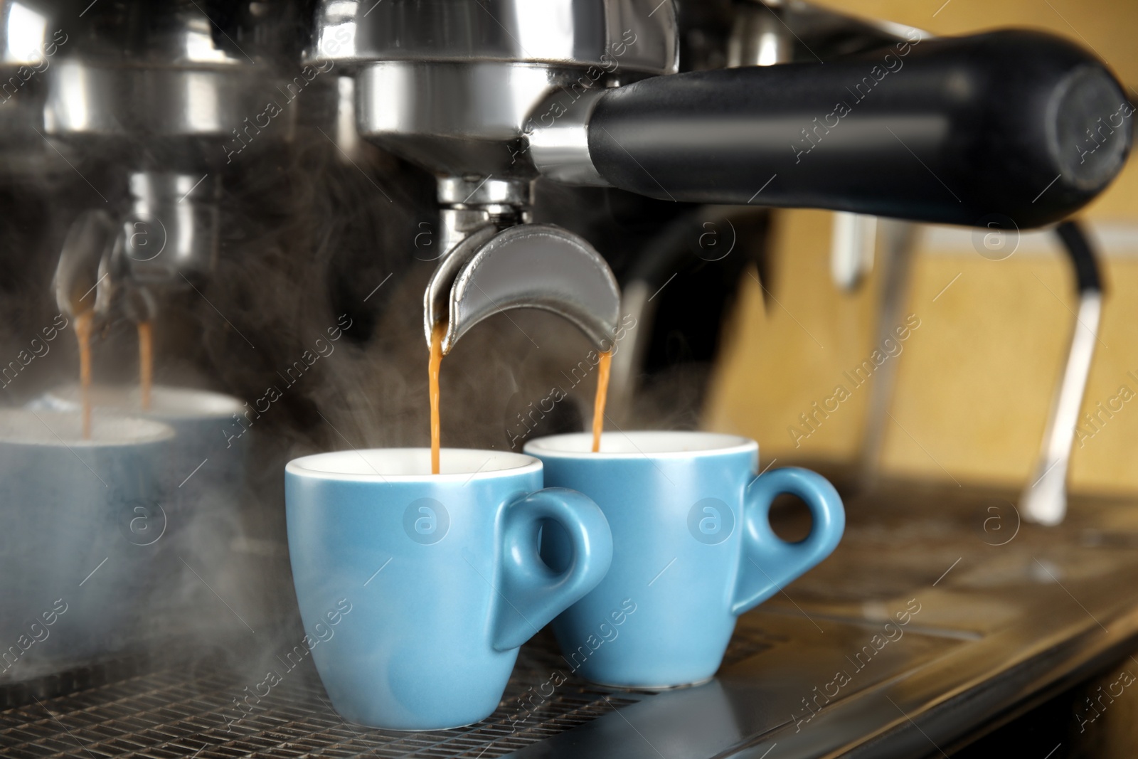 Photo of Making fresh aromatic espresso using professional coffee machine