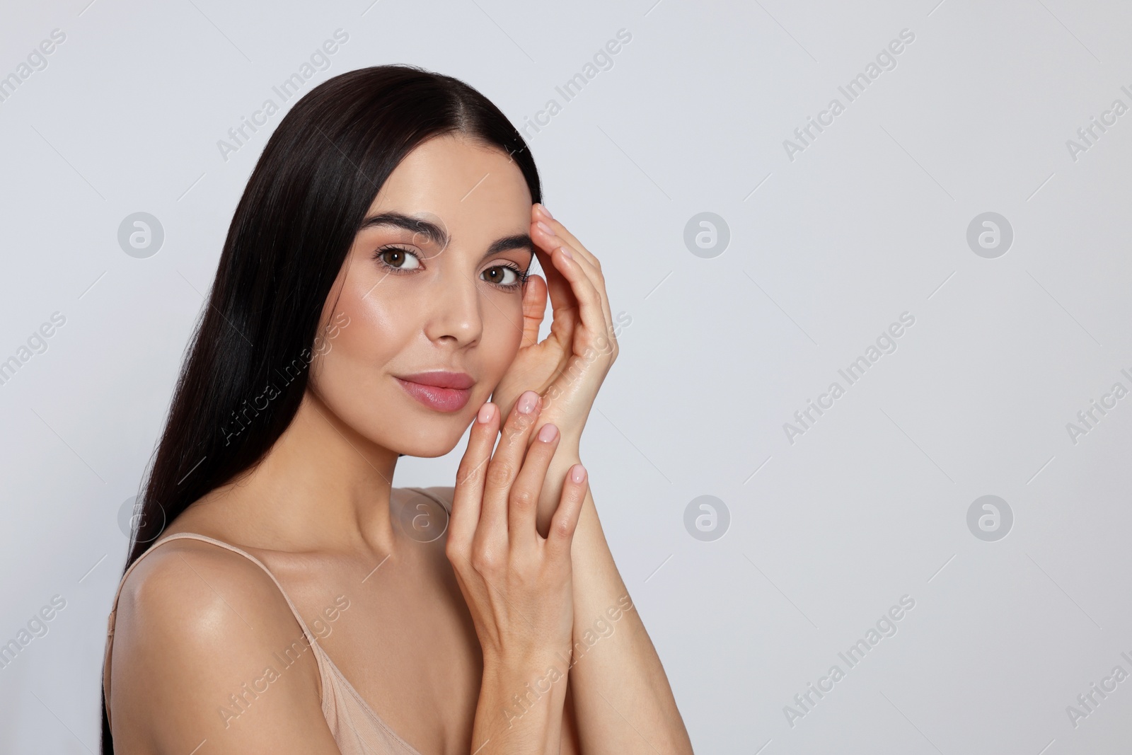 Photo of Portrait of attractive young woman on light grey background, space for text. Spa treatment