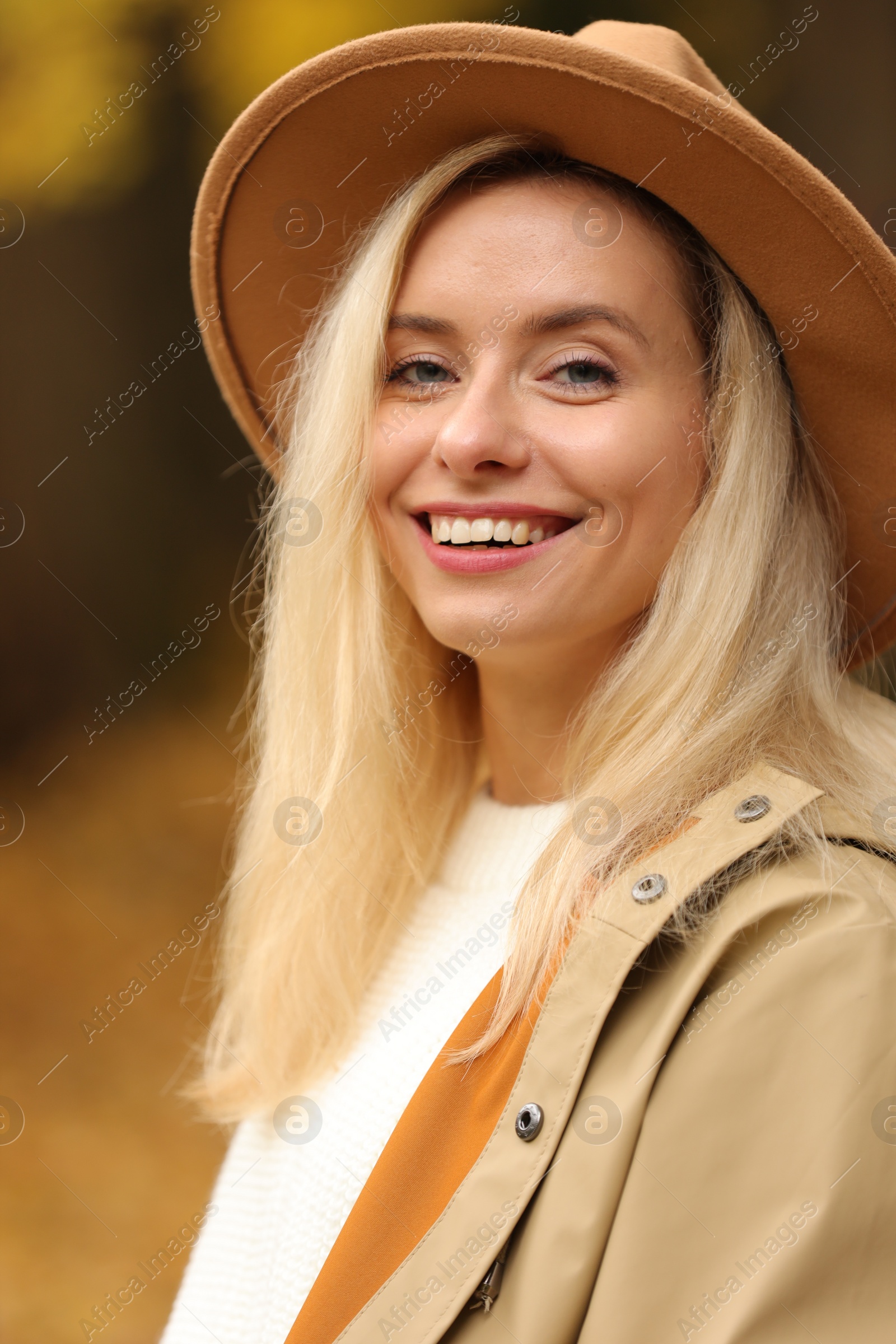 Photo of Autumn vibes. Portrait of happy woman outdoors