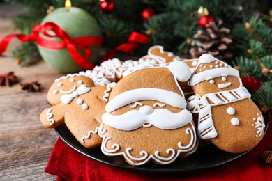 Photo of Delicious Christmas cookies on wooden table, closeup