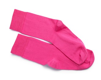 Pair of pink socks on white background, top view