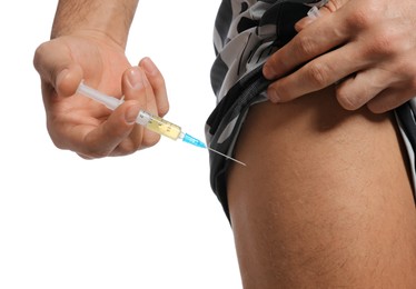 Man injecting himself on white background, closeup. Doping concept