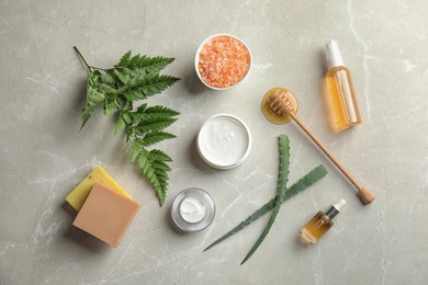 Photo of Flat lay composition with different body care products on grey background