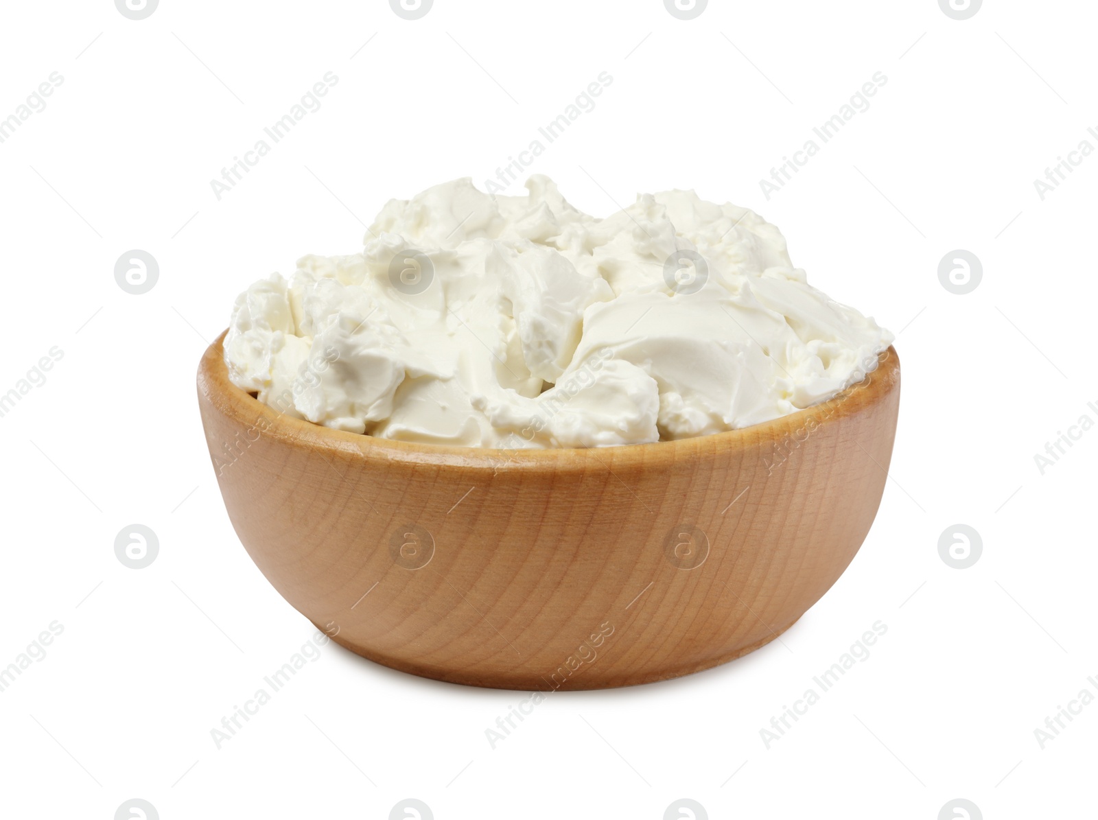 Photo of Wooden bowl of tasty cream cheese isolated on white