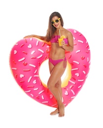 Photo of Beautiful young woman with inflatable heart and glass of cocktail on white background