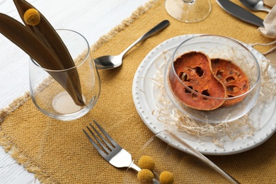 Photo of Autumn table setting with dried pumpkin slices on white background