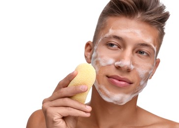 Photo of Young man washing his face with sponge on white background