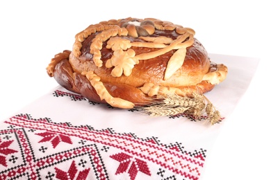 Photo of Rushnyk with korovai on white background. Ukrainian bread and salt welcoming tradition