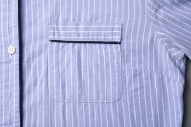 Striped shirt with pocket as background, top view