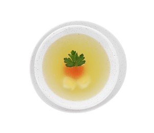 Tasty soup with vegetables and parsley in bowl isolated on white, top view