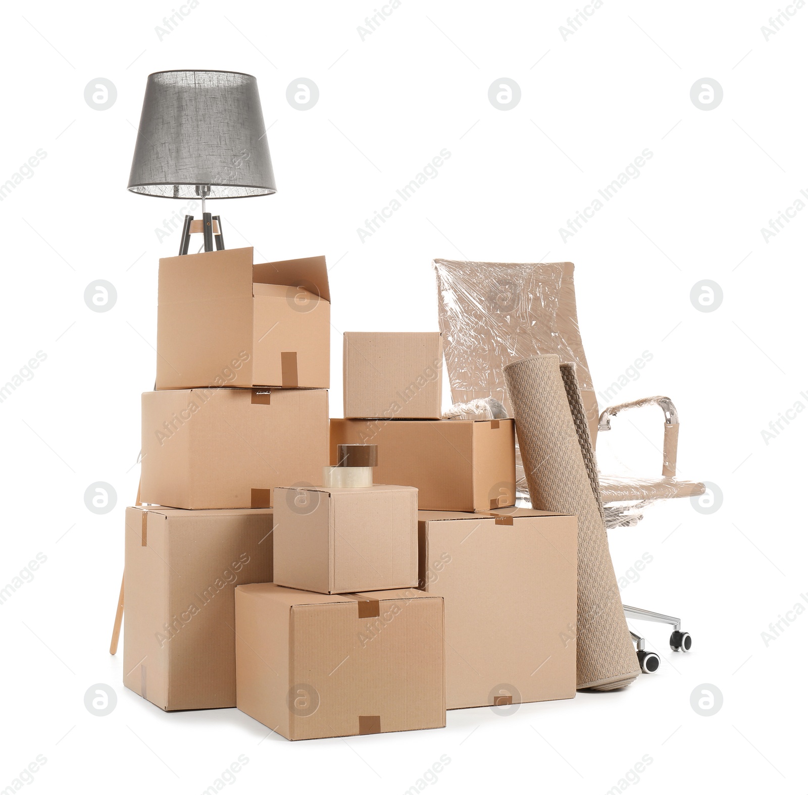 Photo of Cardboard boxes and household stuff on white background. Moving day