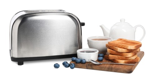Photo of Toaster, bread with jam, blueberries and tea on white background