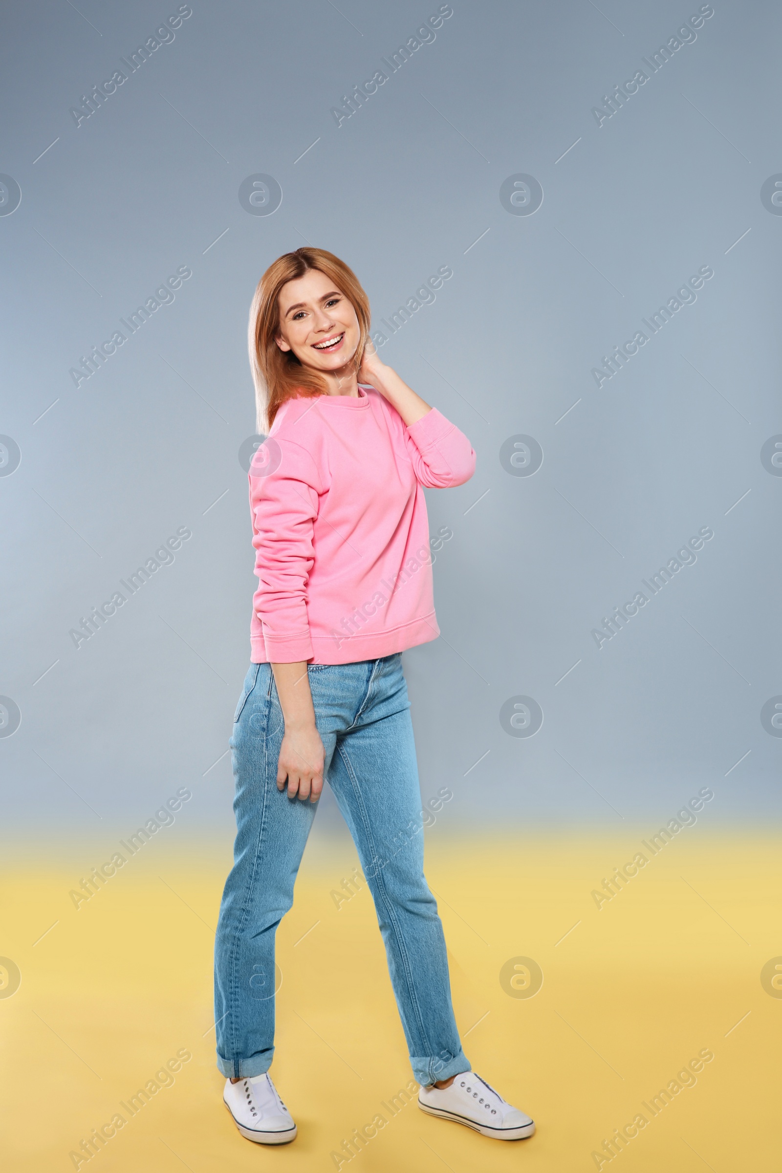 Photo of Full length portrait of beautiful woman on color background