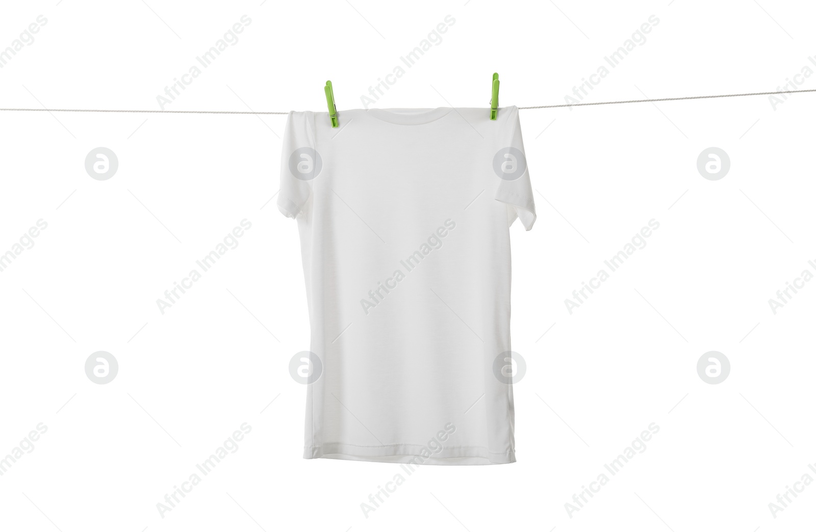 Photo of One t-shirt drying on washing line isolated on white