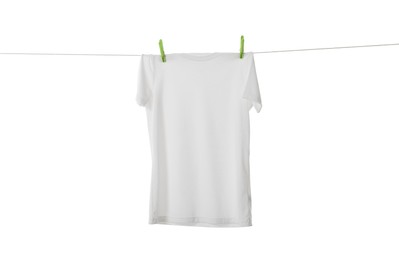 One t-shirt drying on washing line isolated on white