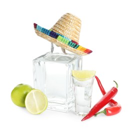 Mexican sombrero hat, tequila, chili peppers and limes isolated on white